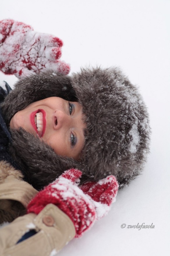 laugh woman laying on the snow 2_1200x800